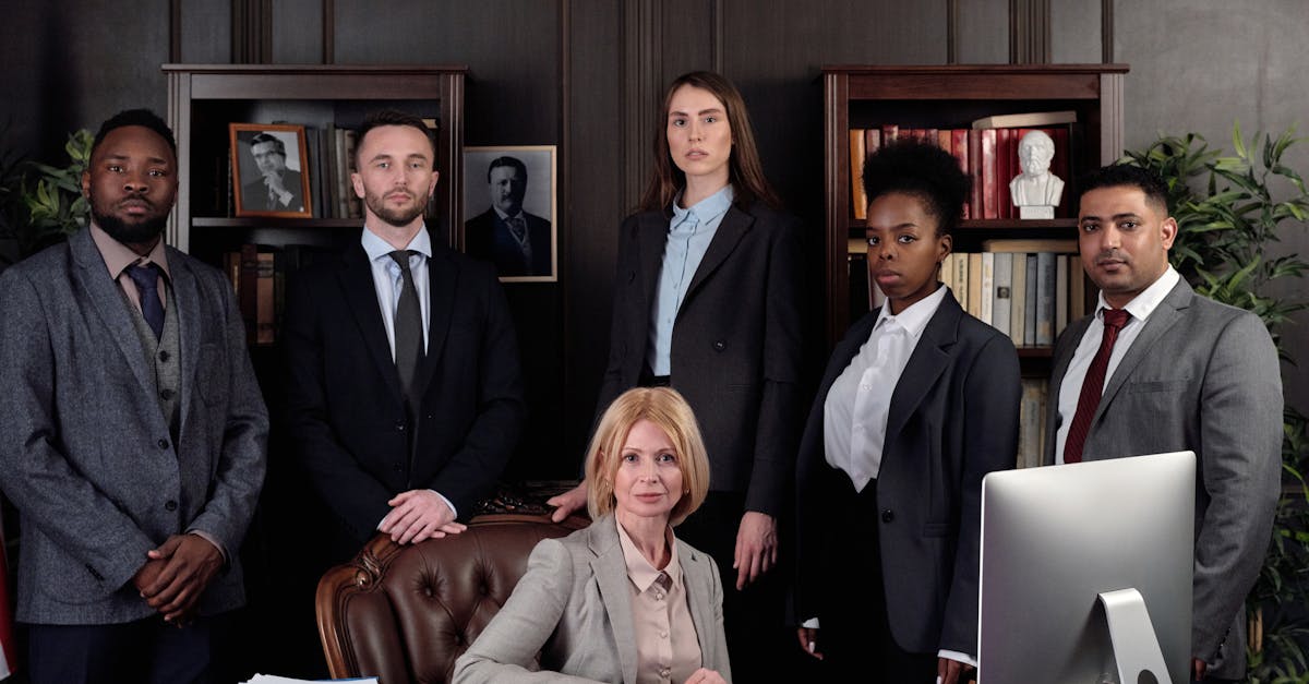diverse group of professionals in corporate attire posing confidently in an office environment